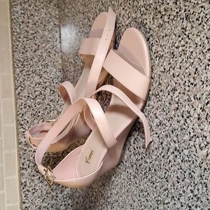 Blush colored wedge shoes